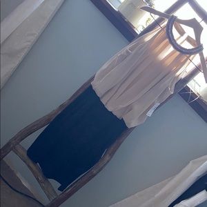 Beautiful dress never worn. 1 clasp needs a loop.